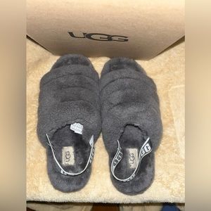 Gray and white Ugg slippers.